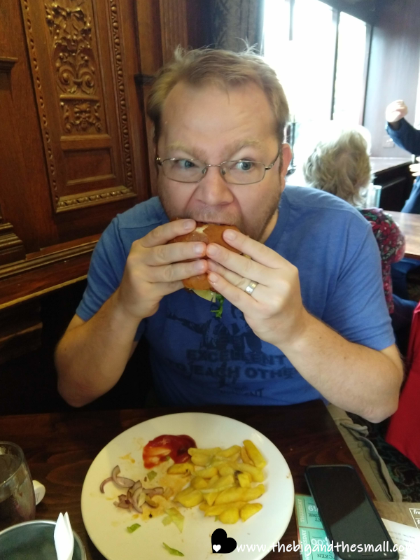 Joel eating large burger.png