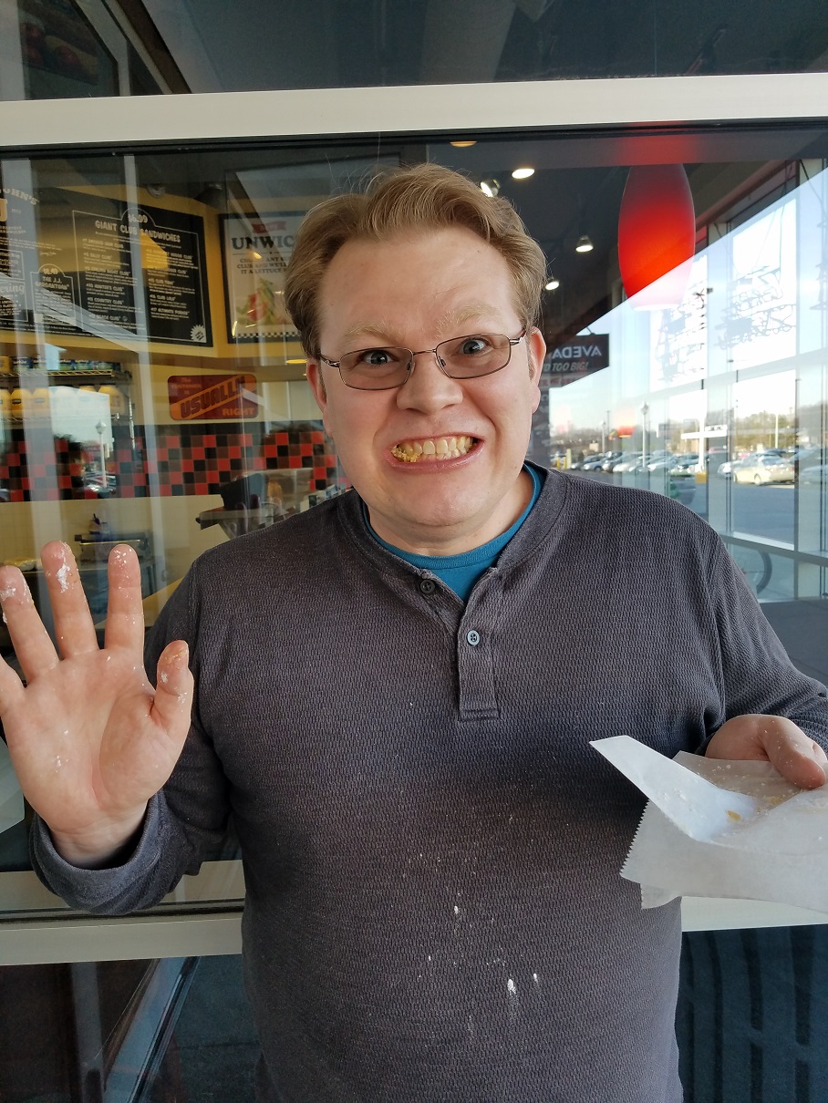 Joel covered in powdered sugar